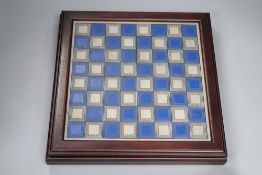 A boxed Battle of Waterloo chess set, with board to lid of box