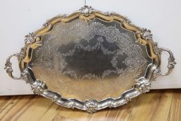 A large shaped oval silver two-handled tray with shell and scroll border, Edward Barnard & Sons,