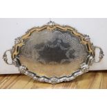 A large shaped oval silver two-handled tray with shell and scroll border, Edward Barnard & Sons,