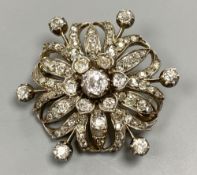 A Victorian pierced yellow and white metal, graduated diamond set circular brooch, 36mm, gross 12.
