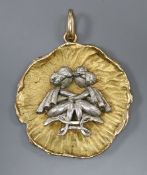 A 9ct yellow metal leaf pendant, with white metal figural applique, 35mm, gross 12.6 grams.