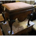 A George III mahogany box stool, the hinged lid with upholstered top above shaped apron and cabriole