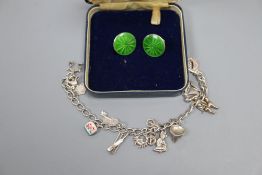 A pair of early George V silver and green enamel circular ear clips, 18mm and a modern white metal