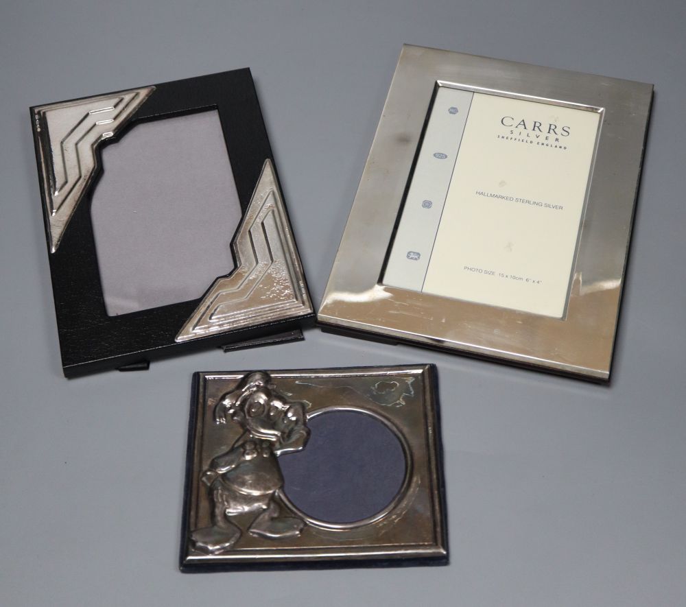 Three assorted modern mounted photograph frames including two silver, largest 20.2cm.
