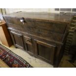 A French elm dough bin on cabinet base fitted two doors and a small central drawer, width 162cm,