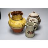 Two studio pottery jugs, one by Paul Barron of Farnham and a lidded jar, by Jonathan Chiswell