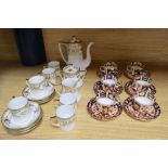 A set of six Royal Crown Derby miniature tea cups and saucers, date codes 1920's and a Noritake