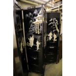 A Japanese black-lacquered and painted four-fold screen with applied decoration of geishas and