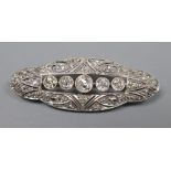 A 1920's pierced white metal and diamond set shaped oval brooch, 42mm, gross 5.8 grams.CONDITION: