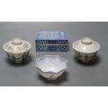 A pair of Chinese famille rose bowls and covers, late 19th century, a blue and white box and