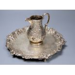 A Victorian embossed silver milk jug, Sheffield, 1860 and a silver salver, London, 1857, 27.5cm,