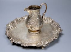 A Victorian embossed silver milk jug, Sheffield, 1860 and a silver salver, London, 1857, 27.5cm,