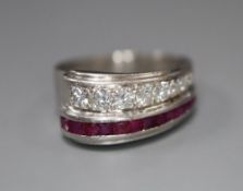 A stylish white metal (stamped Plat), graduated ruby and diamond set twin row dress ring, size O,