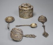 A Dutch oval silver tea caddy, embossed with cherubs and scrolls, 1893 import marks and four