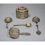 A Dutch oval silver tea caddy, embossed with cherubs and scrolls, 1893 import marks and four