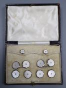 A cased mid 20th century 9ct & 18ct, mother of pearl and seed pearl set eight piece octagonal