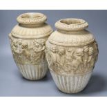 A pair of 19th century earthenware vases relief moulded in Italian Renaissance style, 30cm