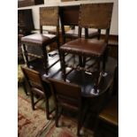 A 1930's oak extending dining table 234cm extended (two spare leaves) and seven dining chairs (one