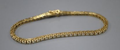 A modern Italian 18ct gold and diamond set line bracelet, 18.8cm, gross 13.7 grams, set with fifty