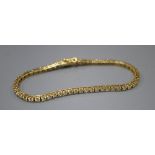 A modern Italian 18ct gold and diamond set line bracelet, 18.8cm, gross 13.7 grams, set with fifty
