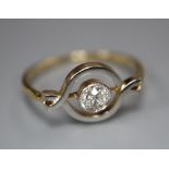 An 18ct and solitaire diamond set ring, in openwork setting, size M, gross 2.2 grams.CONDITION: