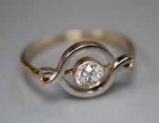An 18ct and solitaire diamond set ring, in openwork setting, size M, gross 2.2 grams.CONDITION: