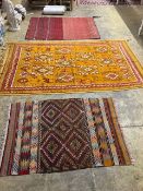 Two Kelim rugs and a geometric wool rug, largest 240 x 140cm