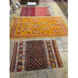 Two Kelim rugs and a geometric wool rug, largest 240 x 140cm