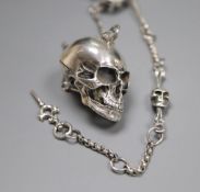 A sterling novelty skull locket?, on a skeletal albert chain, 32.5cm, gross 54 grams.