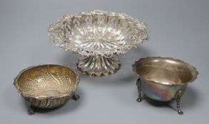 A pierced and embossed silver footed bowl, maker C.C, Chester 1907 and two silver sugar bowls, one