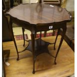 A late Victorian mahogany shaped circular topped two tier table, 67cm diameter, 72cm high