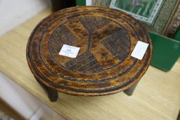 A Nigerian tribal stool, diameter 30cm height 20cm