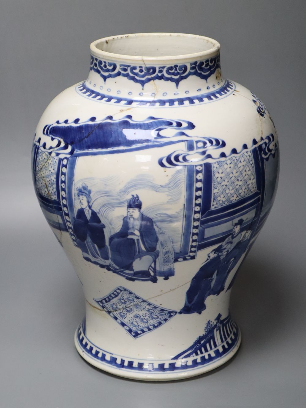 A Chinese Kangxi period blue and white baluster vase, repaired, 35cm