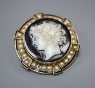 A 19th century gold (tests as 14ct), enamel and pearl target pendant brooch, centred by an onyx