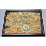 A Chinese Qing dynasty embroidered silk 'dragon' fragment, possibly Imperial, framed, 22 x 28cm