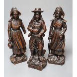 A set of three 19th century Dutch walnut figures of puritans, height 34cm