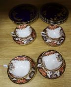 Copeland blue and gilt plates and four Royal Crown Derby cups and saucers