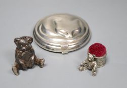 A Tiffany sterling silver circular 'cat' compact, a white metal teddy bear pepper and a pewter teddy
