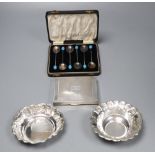 A cased set of six silver bean end coffee spoons, a silver cigarette box and two white metal