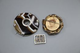 An Edwardian yellow metal, diamond and enamel set initial bracelet buckle, 17mm and two brooches,