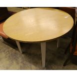 A contemporary circular oak dining table, 110cm diameter