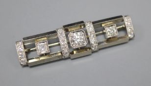 An Art Deco style 585 white and yellow metal, diamond cluster set rectangular bar brooch, 4cm, gross