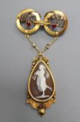 A Victorian yellow metal, ruby, rose cut diamond and carved cameo shell set drop pendant brooch,