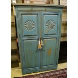A 'distressed' carved and blue-painted pine double wardrobe, width 96cm