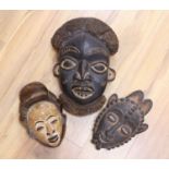 Two Lega tribal wood masks and a Bamileke wood mask (3)