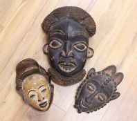 Two Lega tribal wood masks and a Bamileke wood mask (3)