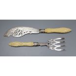 A pair of Victorian carved ivory handled silver fish servers, John Round, Sheffield, 1856, knife,