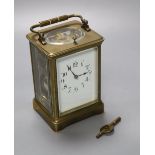 A French brass repeating carriage clock, enamelled dial, Obis case, height 18cm incl. handle