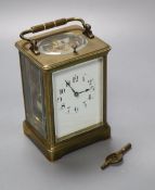 A French brass repeating carriage clock, enamelled dial, Obis case, height 18cm incl. handle