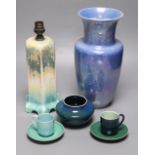 A collection of Ruskin pottery, including a blue lustre vase, a table lamp banded in green, cream